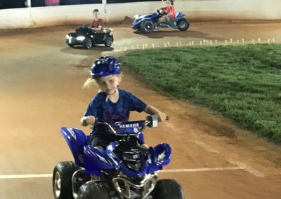 kids racing on the speedway